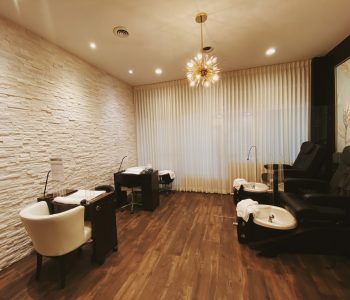 Nail area with pedicure chairs and manicure stations